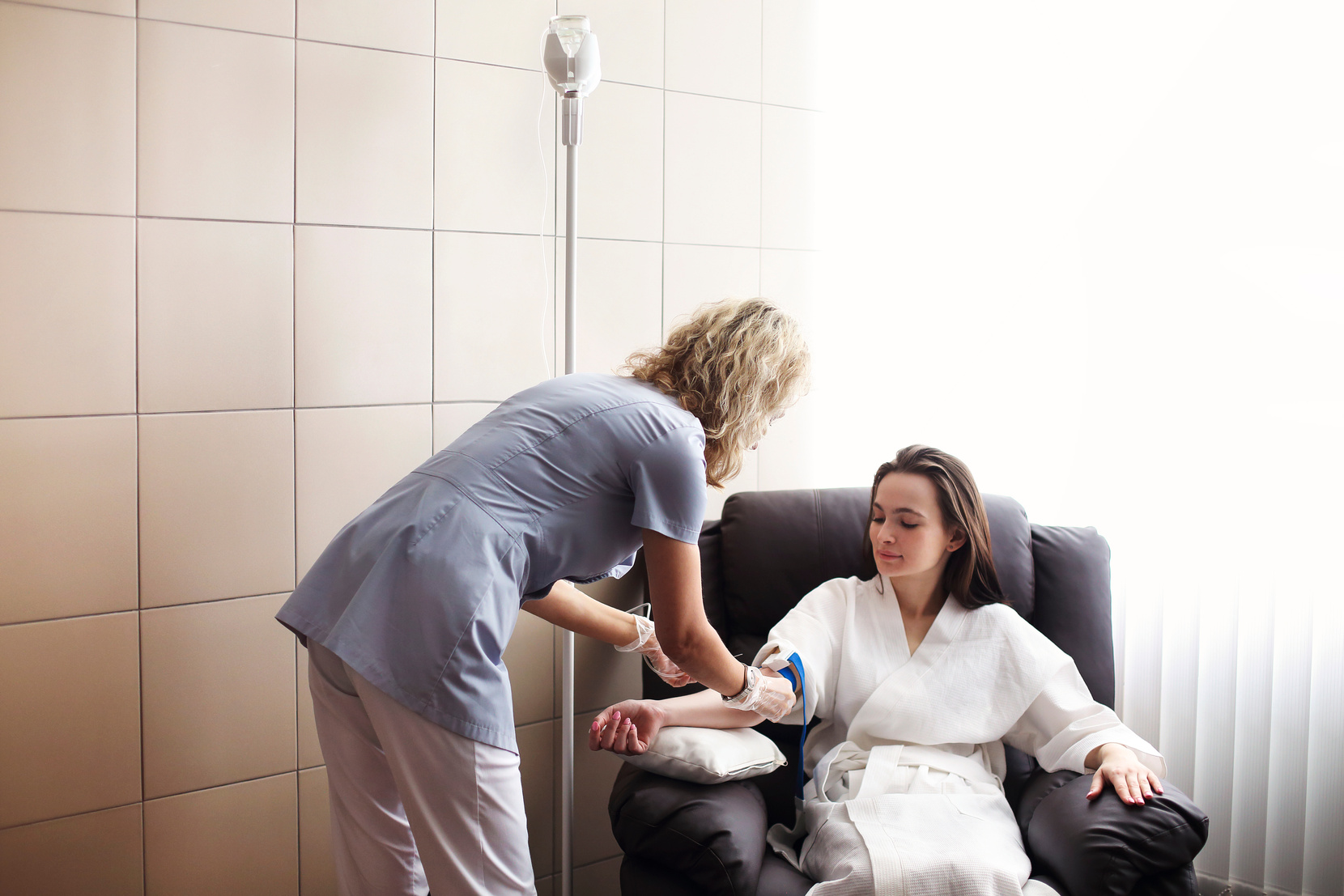 Nurse Preparing Patient for Intravenous Therapy